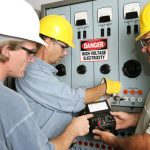 Group,Of,Electricians,Using,An,Ohm,Meter,To,Test,Voltage